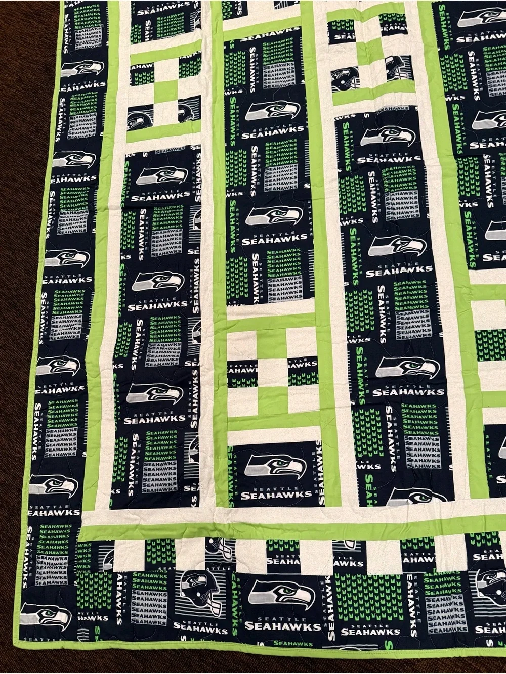 A beautifully crafted, one‑of‑a‑kind handmade throw featuring four detailed trai